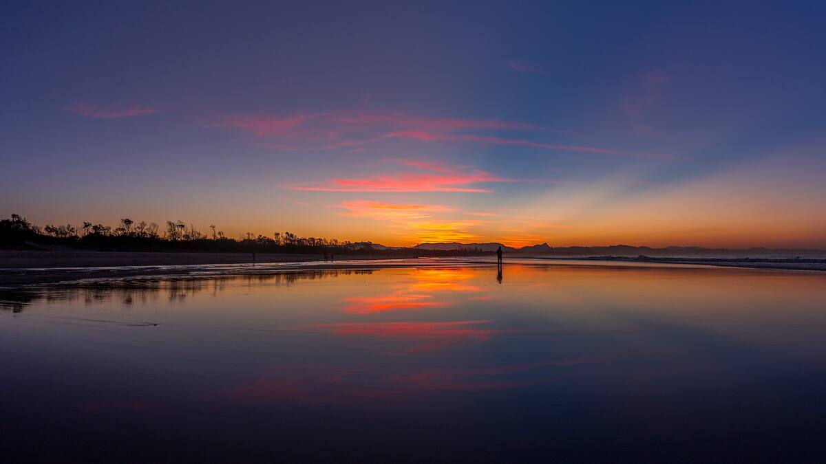 Sunset reflected on the wet sand of a Northern Rivers beach