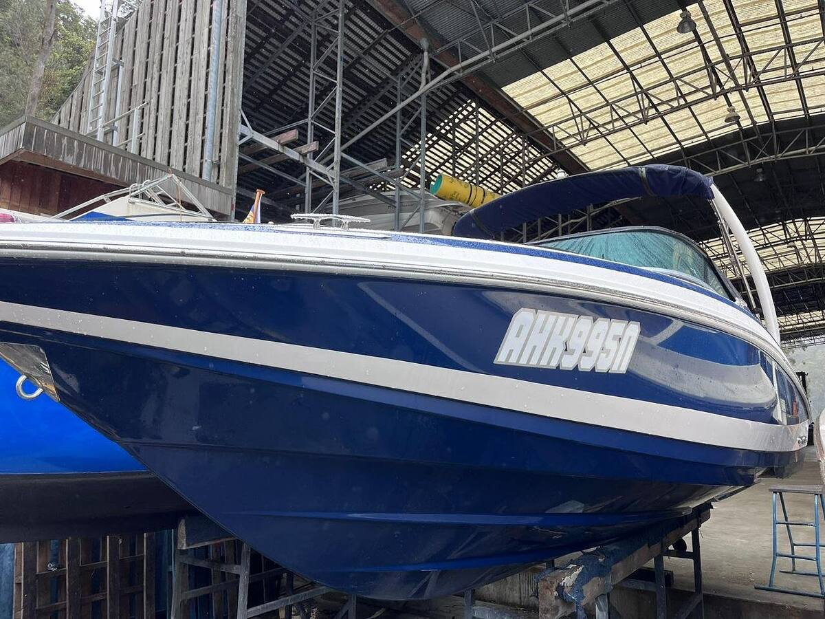 Bowrider with a deep blue hull polished to a gloss, ready to go back on its trailer